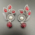Mirana Onyx carving Stone And Pearl AD Earring- Maroon